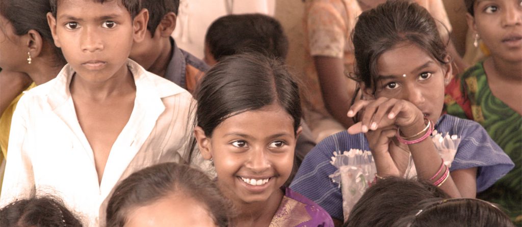 girl smiling in a crowd